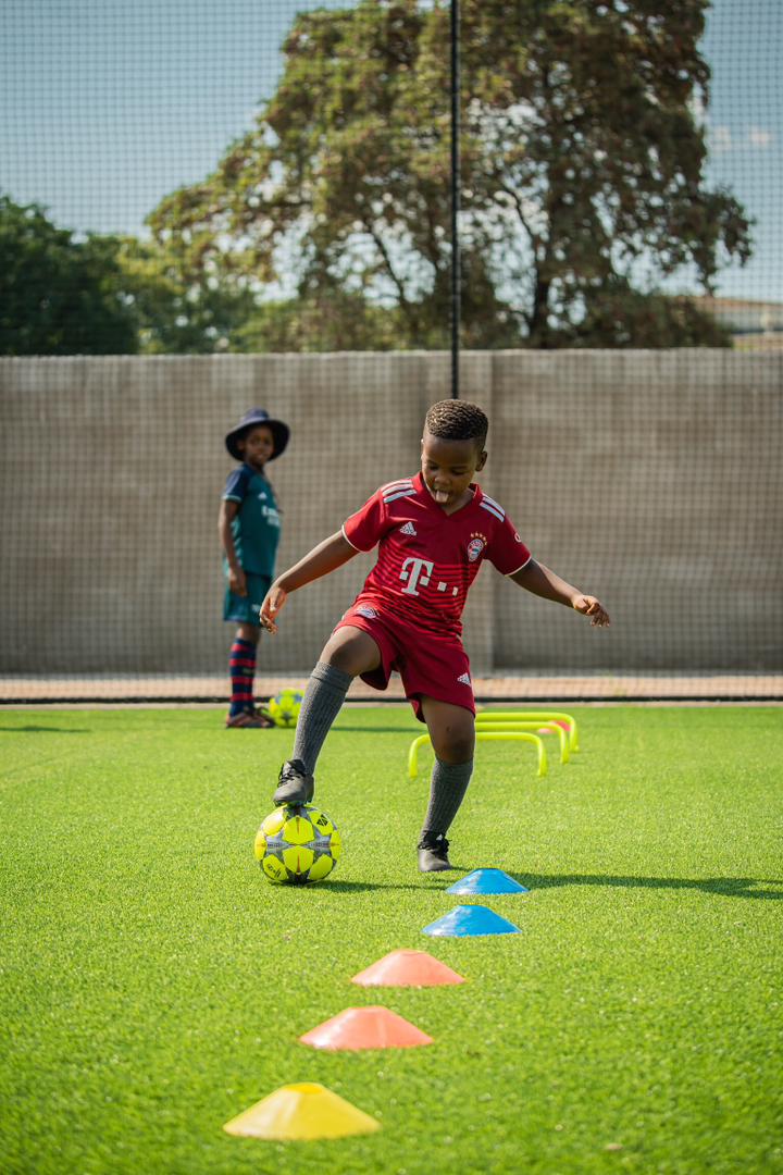 Under 7 player practising close control